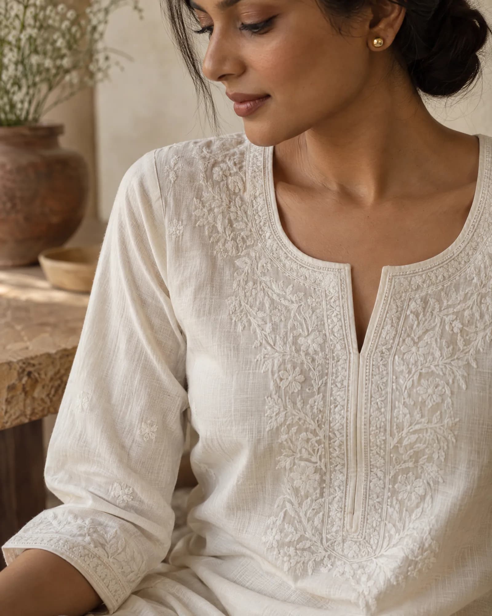 Close-up of the chikankari embroidery at the neckline (Helium-made example)