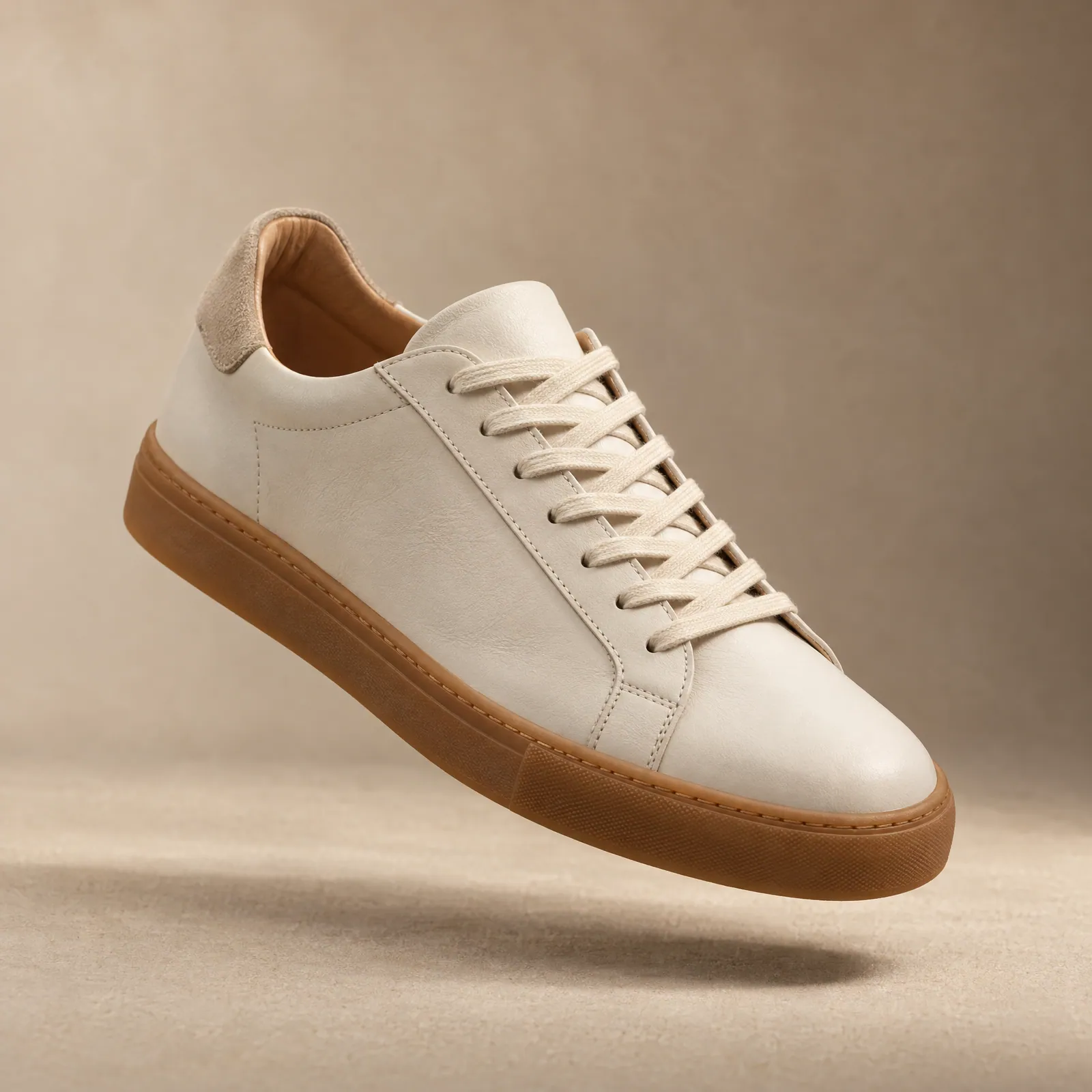 Off-white leather sneaker packshot with gum sole (Helium-made example)