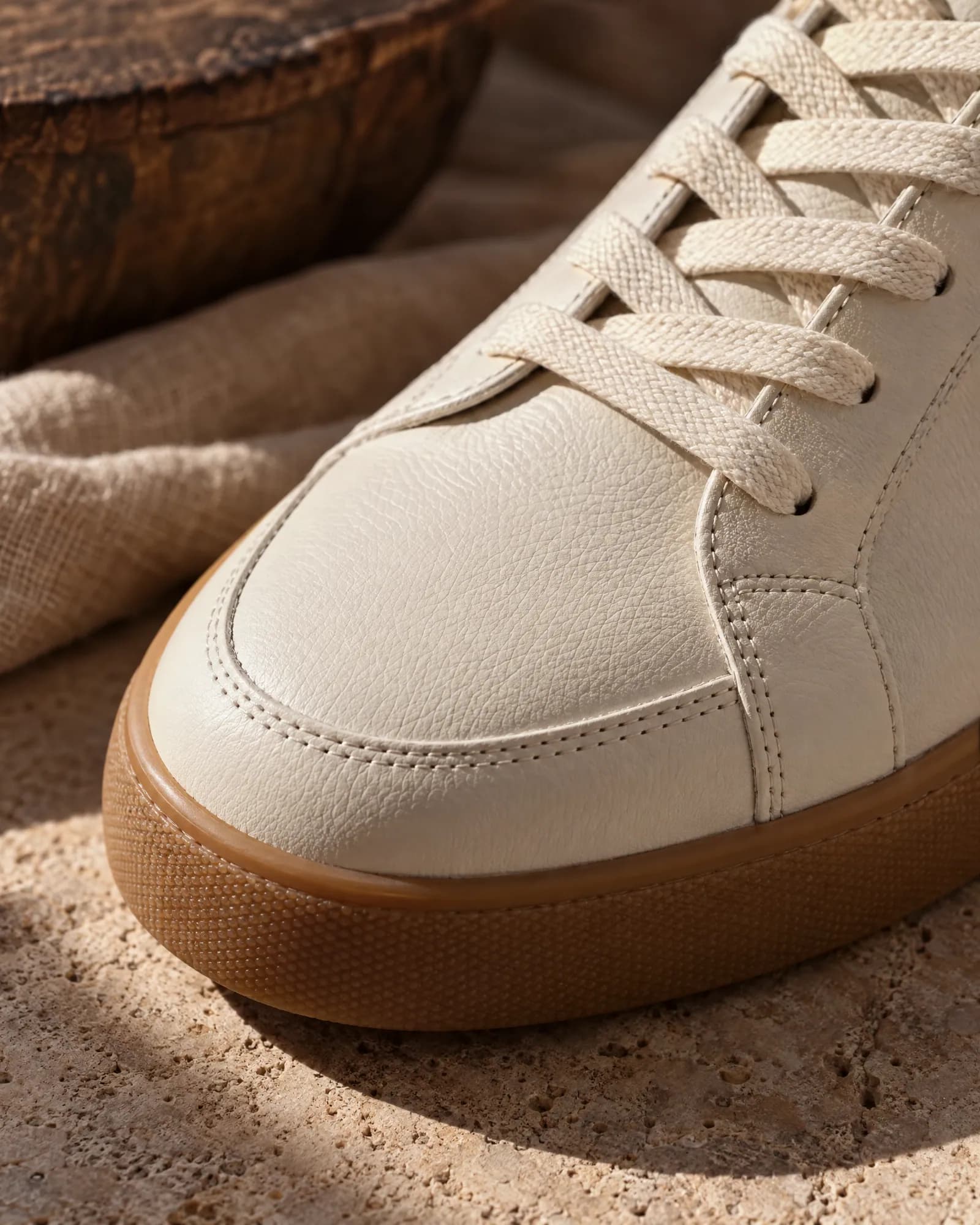Macro of the sneaker's toe stitching and gum sole (Helium-made example)
