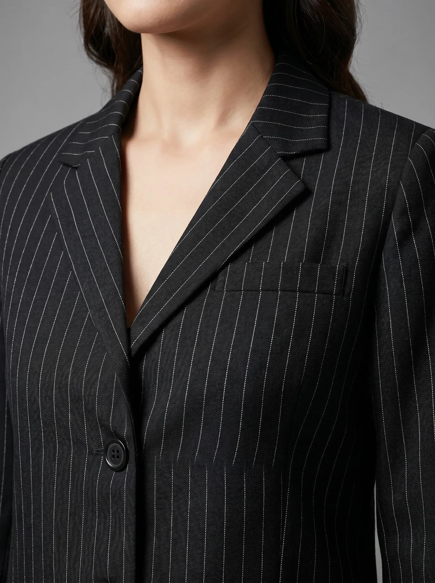 AI fabric close-up of a Bossbella pinstripe blazer