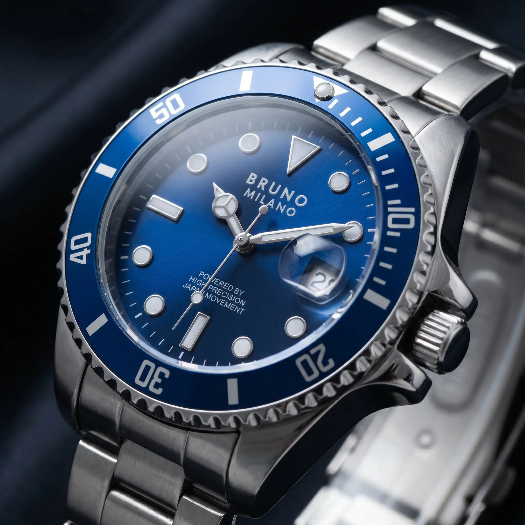 Bruno Milano AI campaign still: blue dial and bezel close-up with crown and steel bracelet